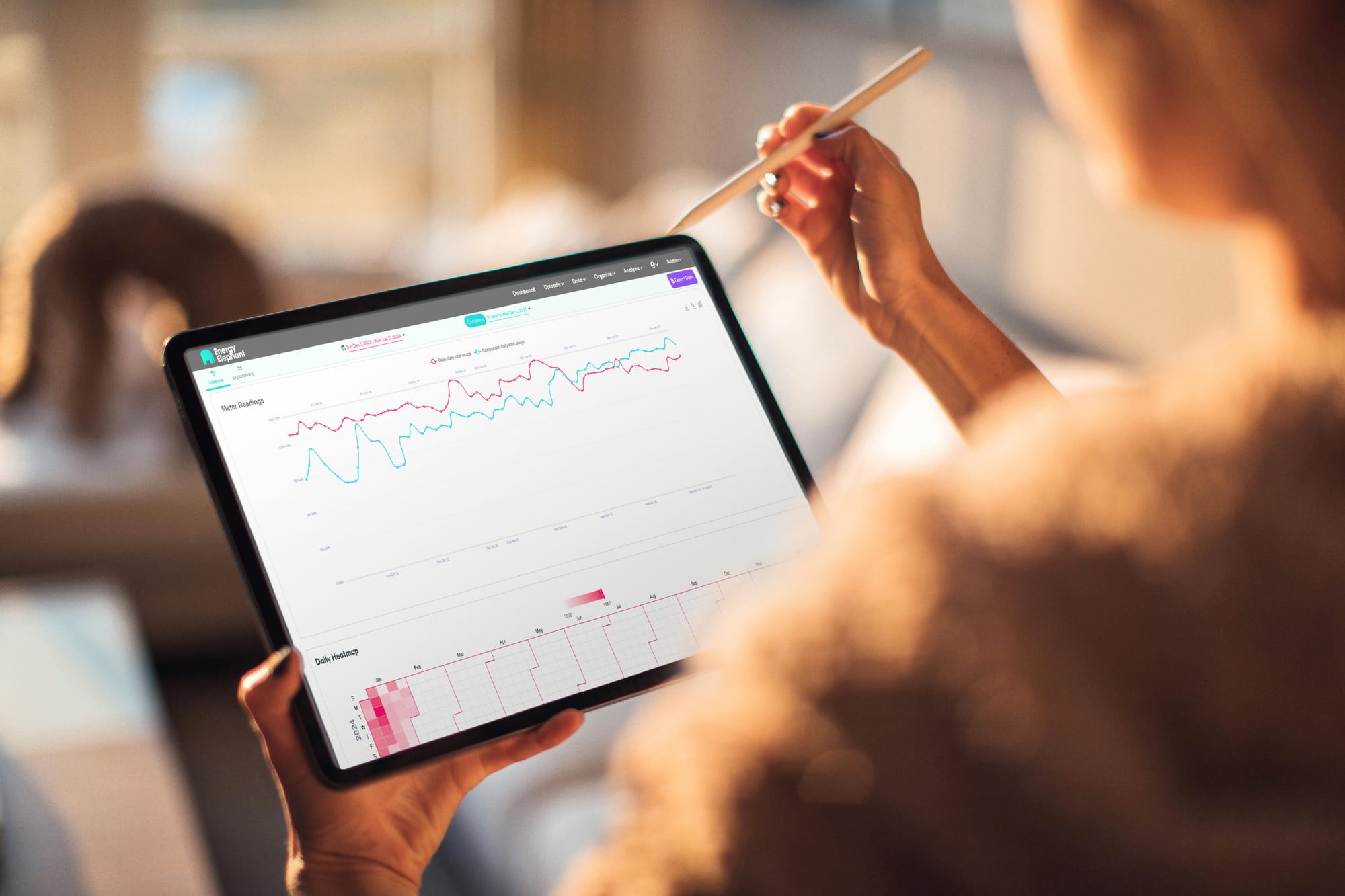 Photo of a person viewing their EnergyElephant dashboard on a tablet.